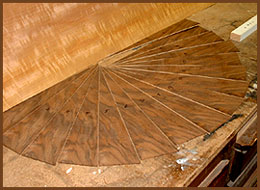 The veneers are laid out in a radial or sunburst pattern